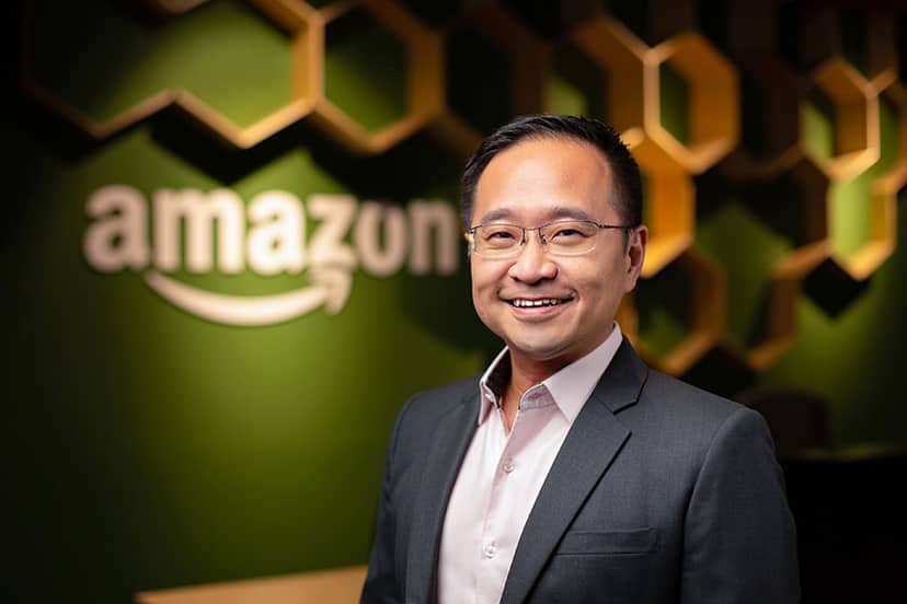 Professional LinkedIn photo example - Singapore executive headshot with corporate branded background