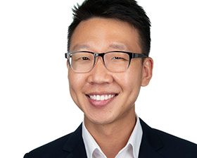 Corporate headshot of Singapore executive in professional attire