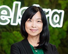 Professional LinkedIn profile photo for Singapore executive with confident approachable expression