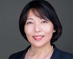 Professional LinkedIn headshot with business attire and a friendly smile